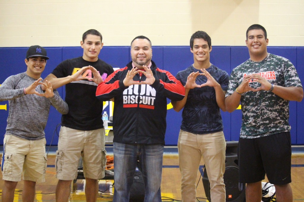 Fabian with Odem HS football players